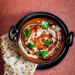 Butter Chicken and Naan on a table