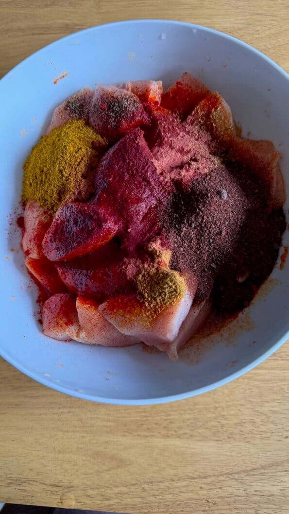 Tandoori Chicken Tikka Bites or Kebab Skewers Tandoori masala added to bowl