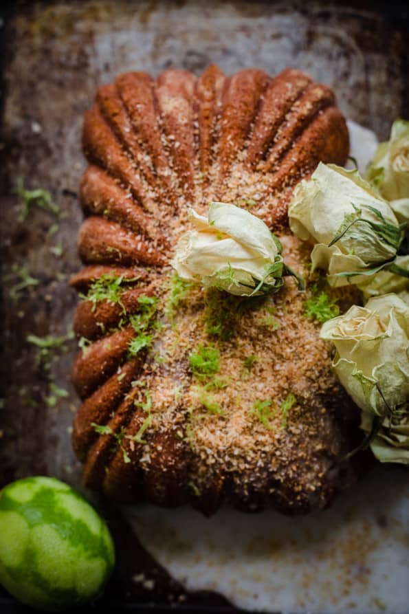 Lime and Coconut Cake bundt loaf with white roses on top