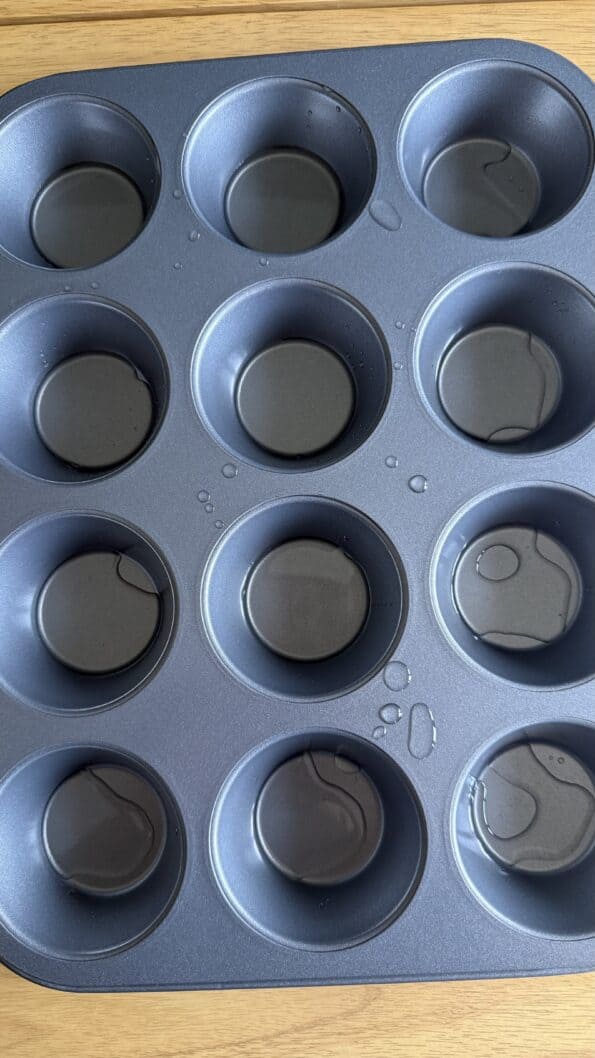 When the oven is hot, a Oil in bottom of muffin holes