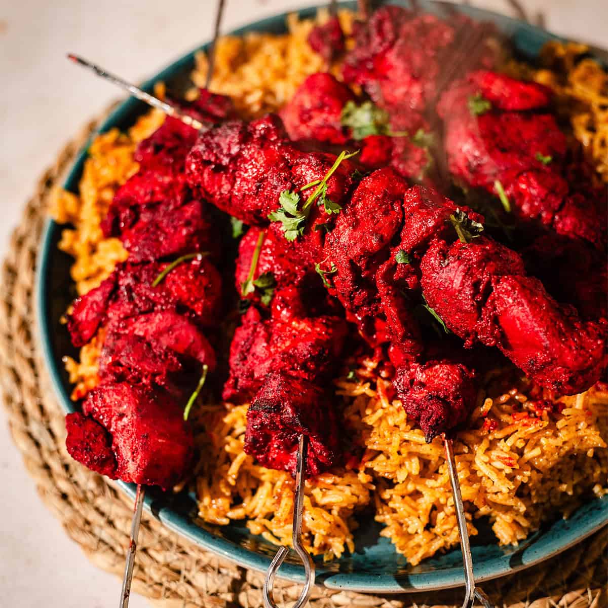 Tandoori Chicken Tikka Bites or Kebab Skewers Tandoori chicken kebabs on bed of rice
