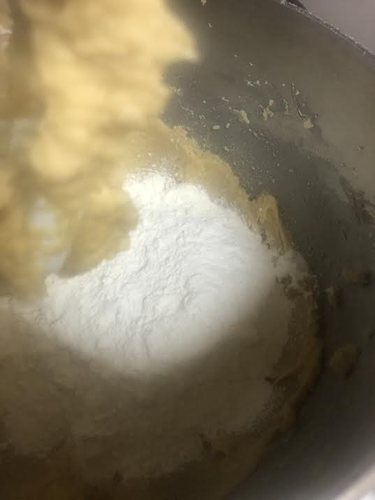 Flour added to bowl of batter