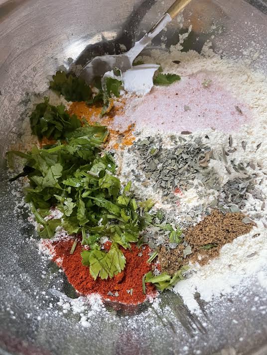 Chopped Coriander added to bowl with flour
