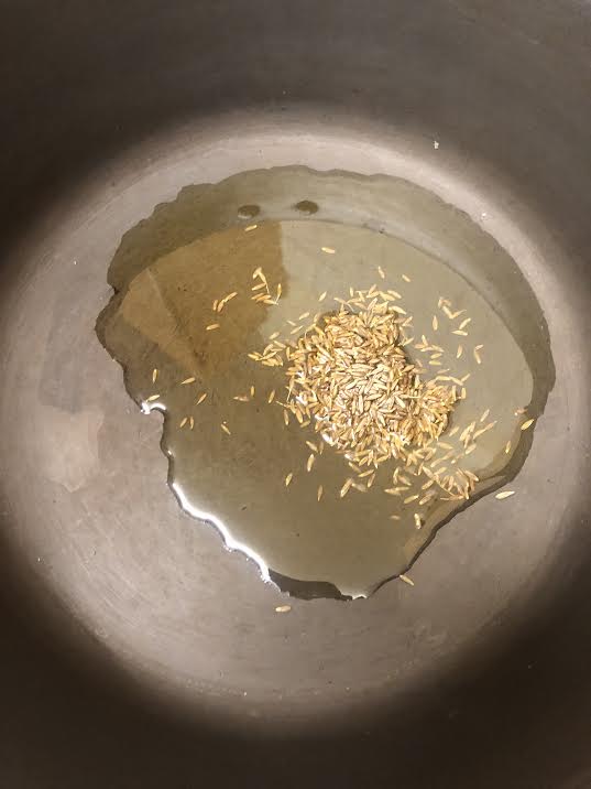 Ghee and Cumin Seeds in a pot