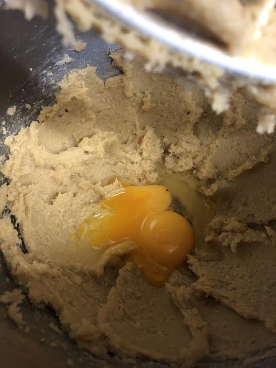 Egg added to batter in stand mixer bowl