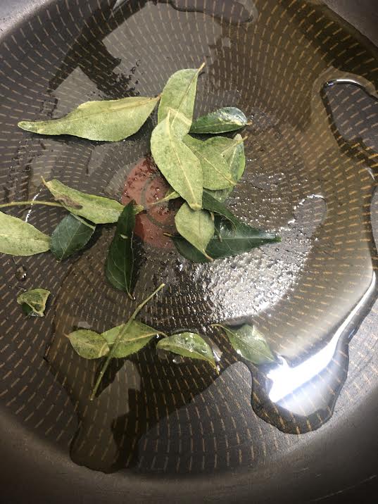 Curry leaves in a pan