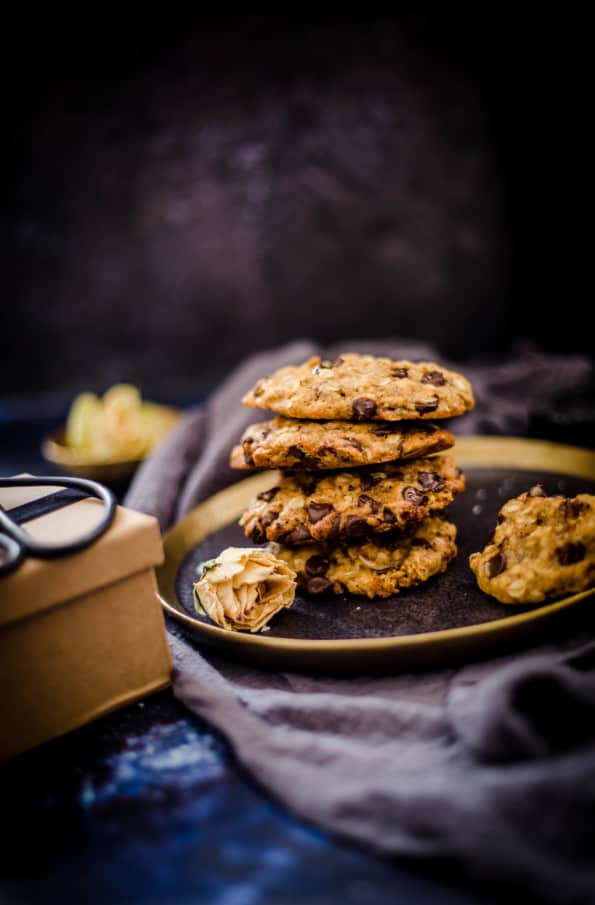 4 oat cookies piled on a plate 