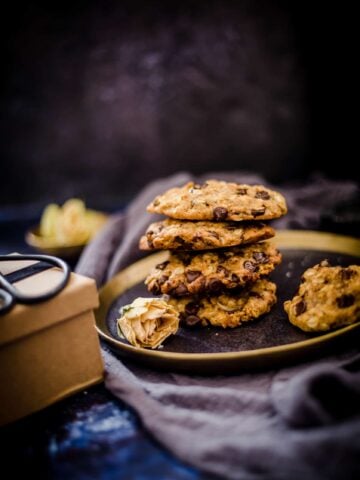 4 oat cookies piled on a plate