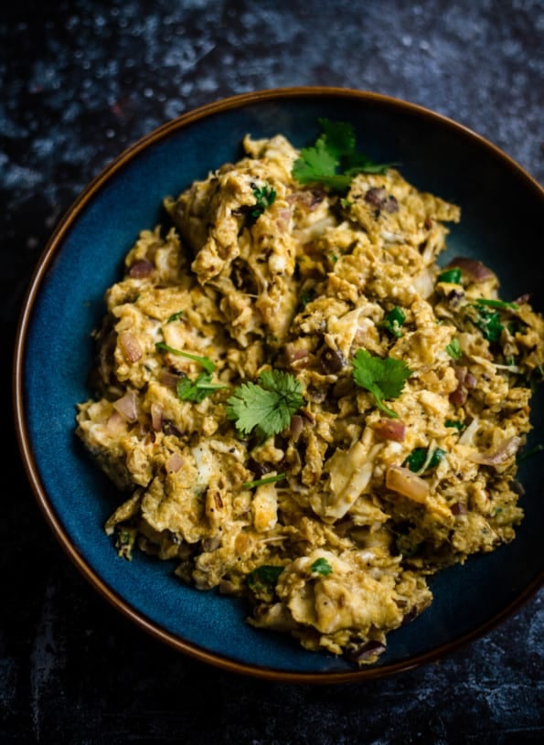 Egg Bhurji in a blue bowl topped with coriander