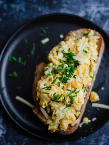 Scrambled Eggs with Cheese and chives on a piece of toast
