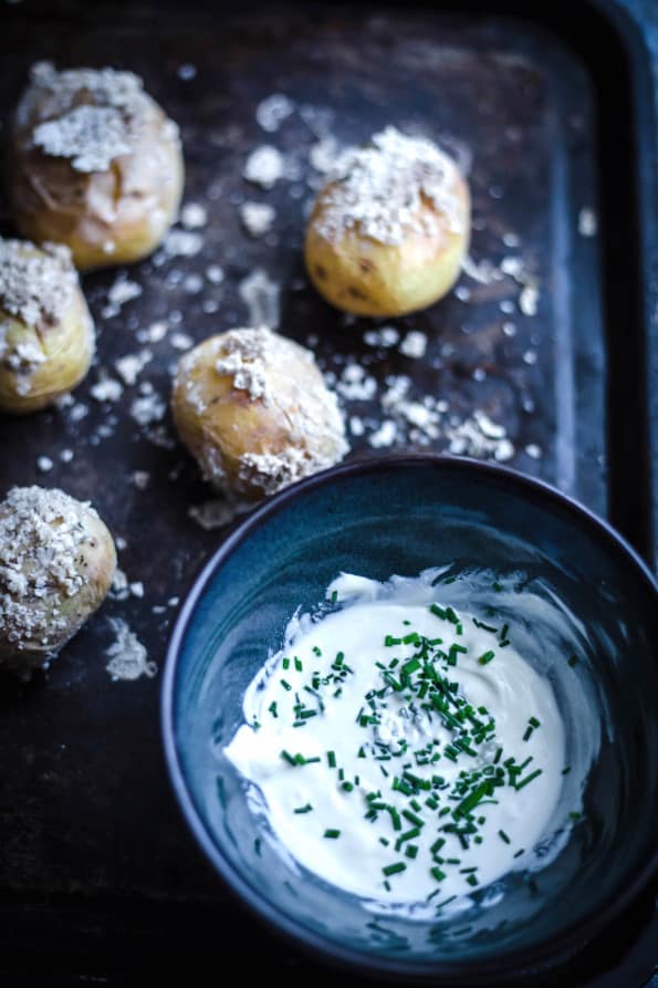 5 Salty Potatoes on a tray with a Chive dip in bowl