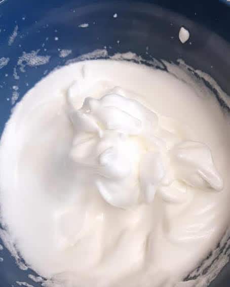 Whipped egg whites in bowl