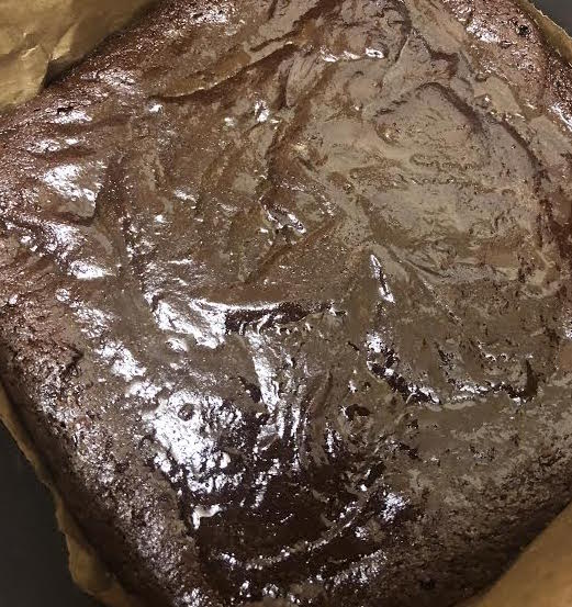 Brownies half baked in tin