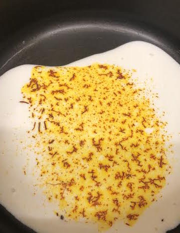 Saffron crumbled into milk