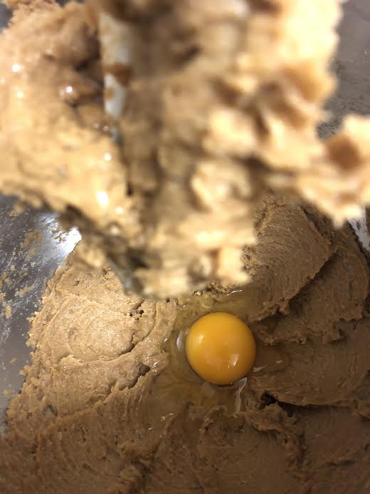Egg added to bowl of stand mixer in bowl