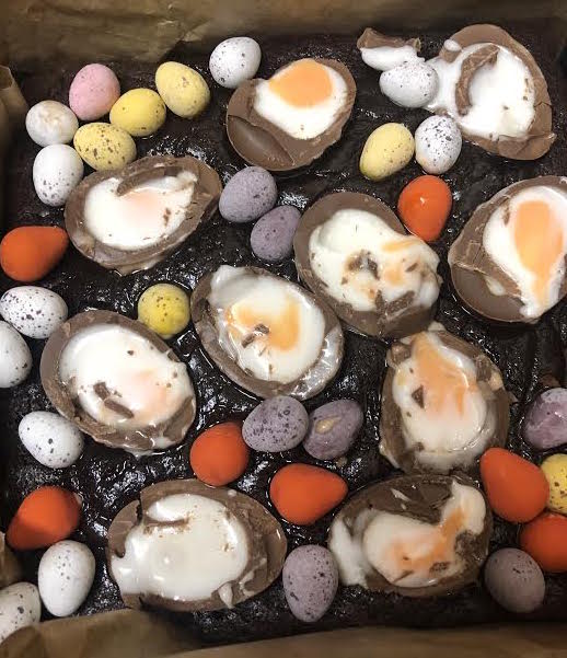 Par baked brownies topped with easter eggs and creme eggs