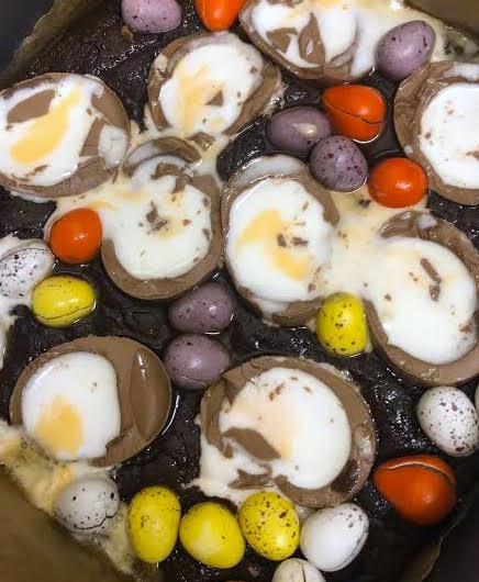 Baked Creme Egg Brownies in a tin