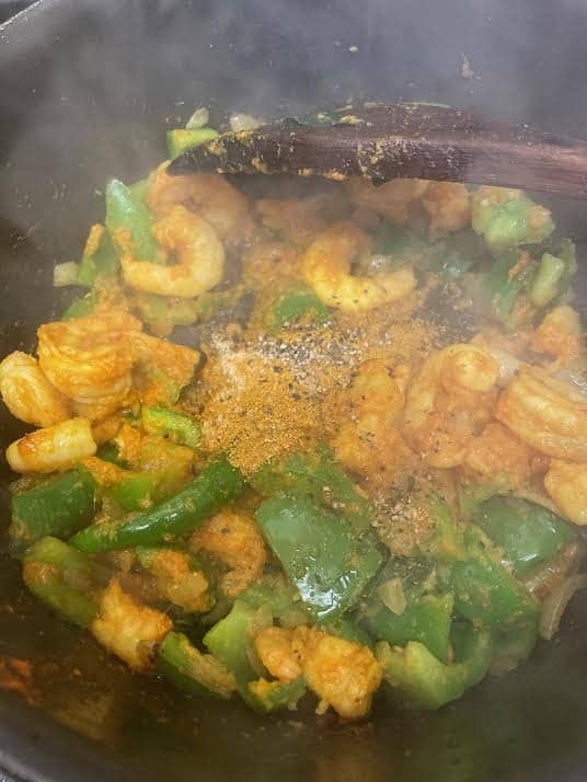 Chilli Prawn Pepper Fry with Garam Masala and black pepper added to the pot
