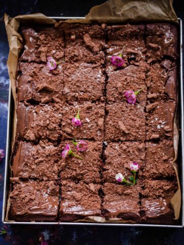 Chocolate Tray Bake with flowers and flaked chocolate