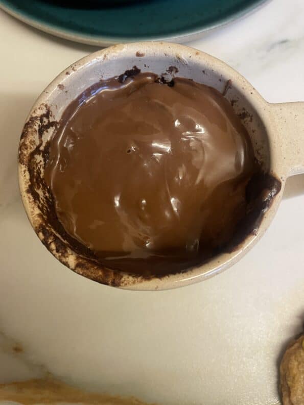 Chocolate on top of cake in mug