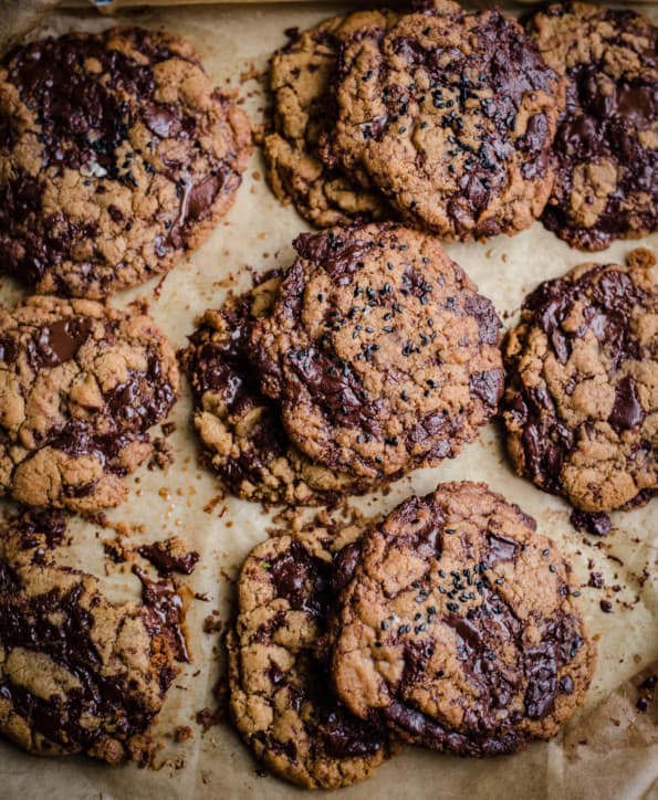 Tahini Chocolate Chip Cookies on a lined baking tray 