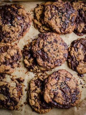 Tahini Chocolate Chip Cookies on a lined baking tray
