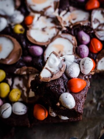 Brownies with creme eggs and min eggs all over the surface