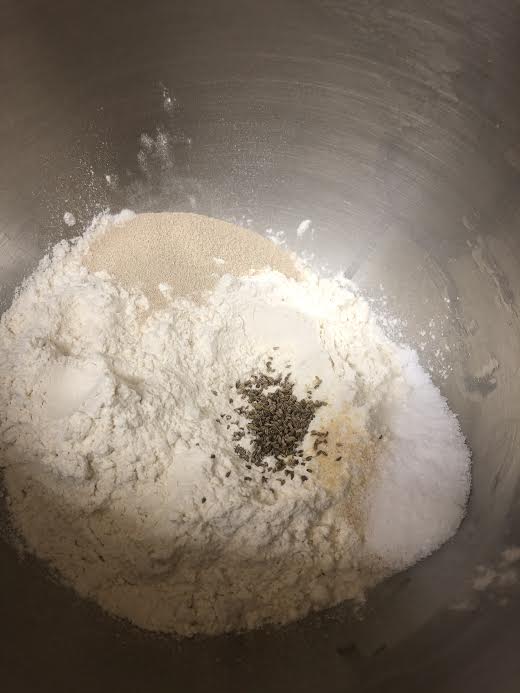 Flour, Yeast, salt and Carom seeds on bowl