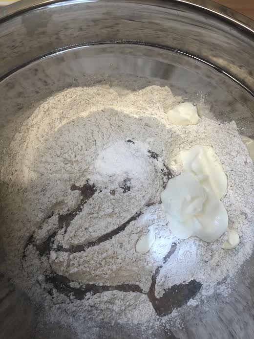 Oil and Yoghurt added to flour in bowl