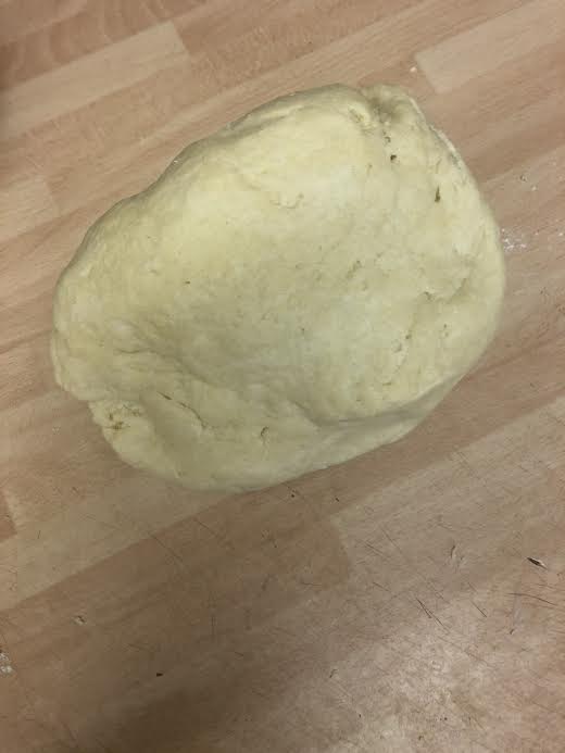 Smooth dough on work surface