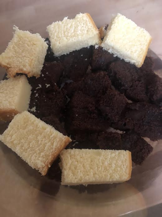 Chocolate and vanilla cake at bottom of trifle dish