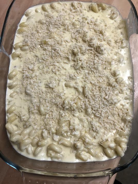 Mac and cheese in dish with breadcrumbs on top