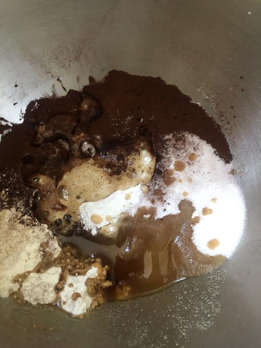 Wet ingredients being poured into dry ingredients 
