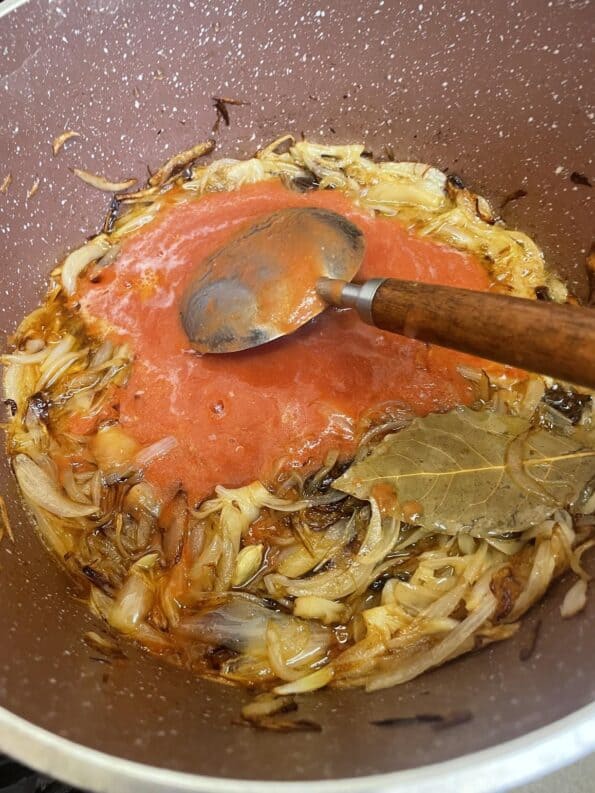 Tomatoes added to pot