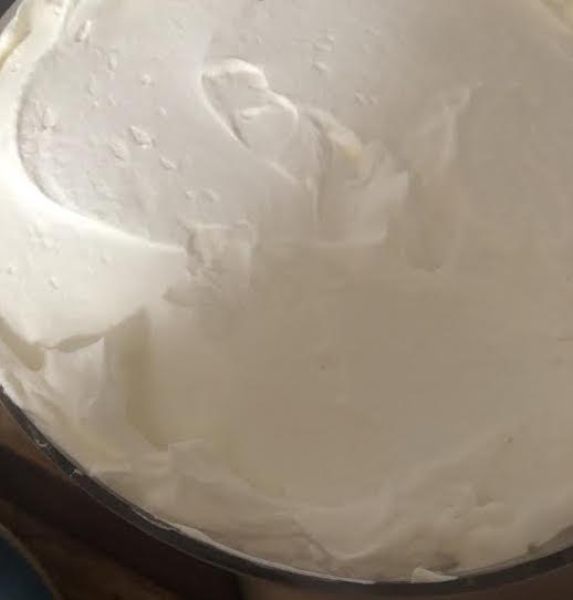 Cream spread on top of the trifle 