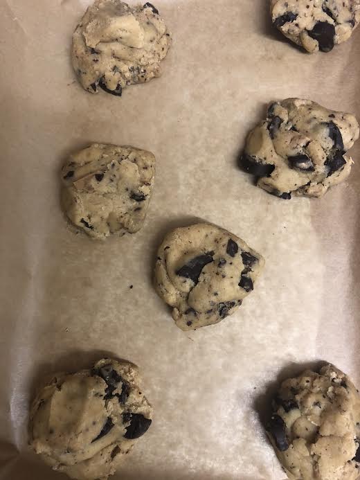 Cookie dough balls on a lined tray