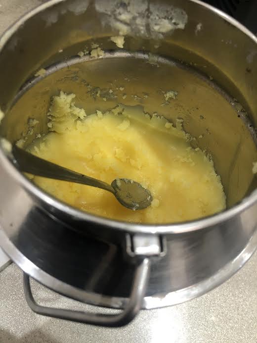 Ghee in container with spoon 