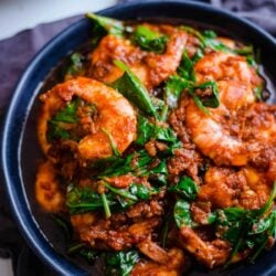 Prawn and Spinach Curry in a blue bowl on a table