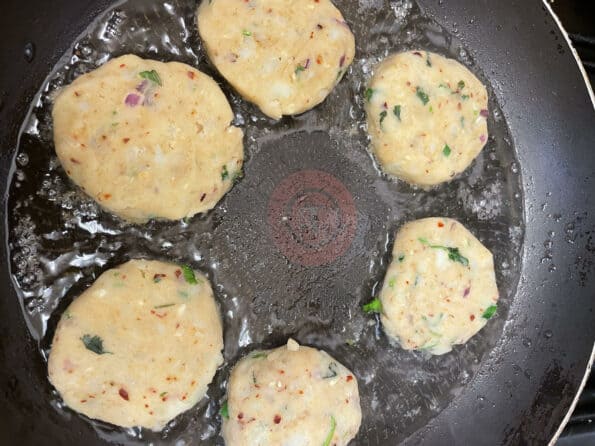 Aloo Tikkis cooking in oil