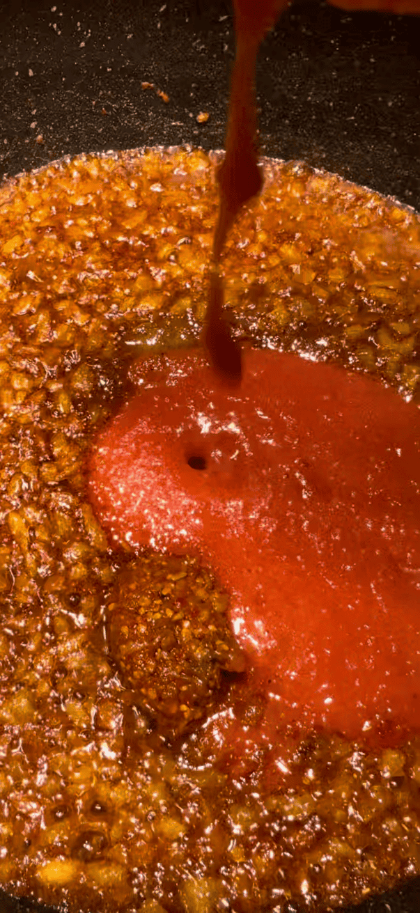 Lamb Chops Curry Pureed Tomatoes added to pot