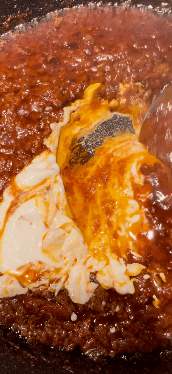 Yoghurt being stirred in pot