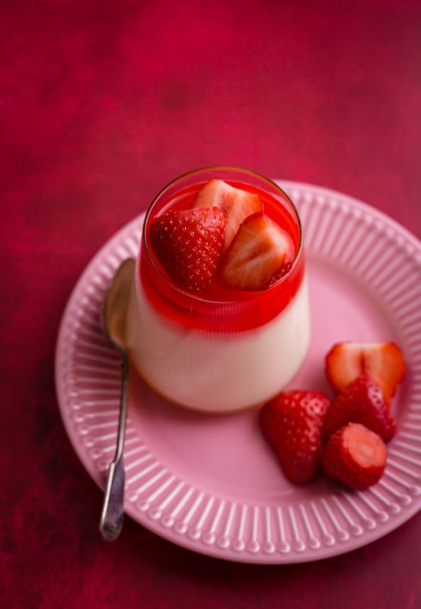 Mahalabia in a cup with strawberries on top