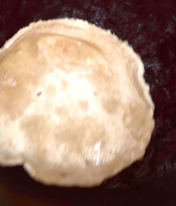 Puffed puri frying in oil
