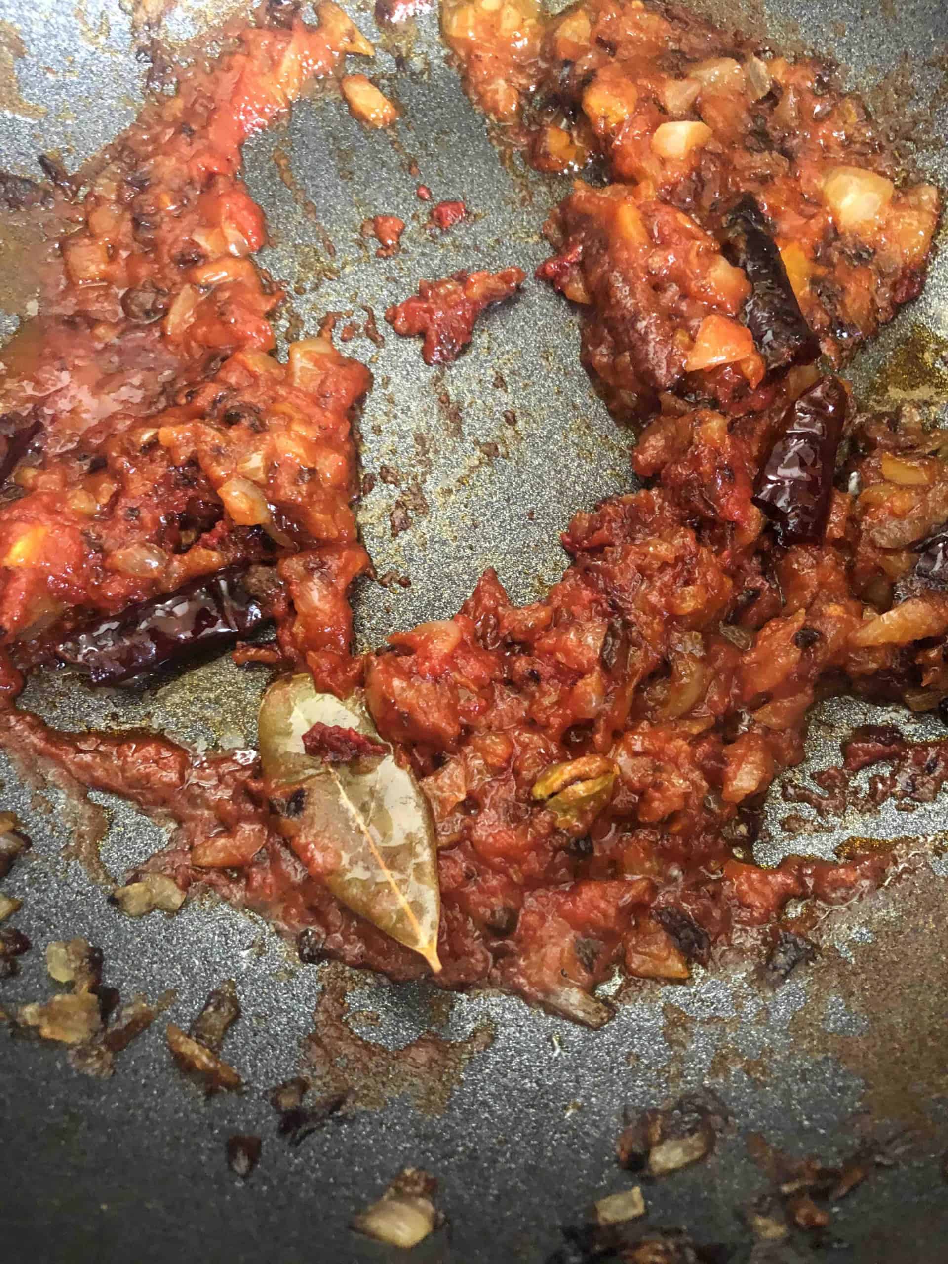 Chicken Bhuna (The Ultimate Restaurant-Style Chicken Curry) Showing reduced tomatoes in wok