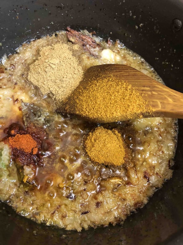 Powdered spices added to pot