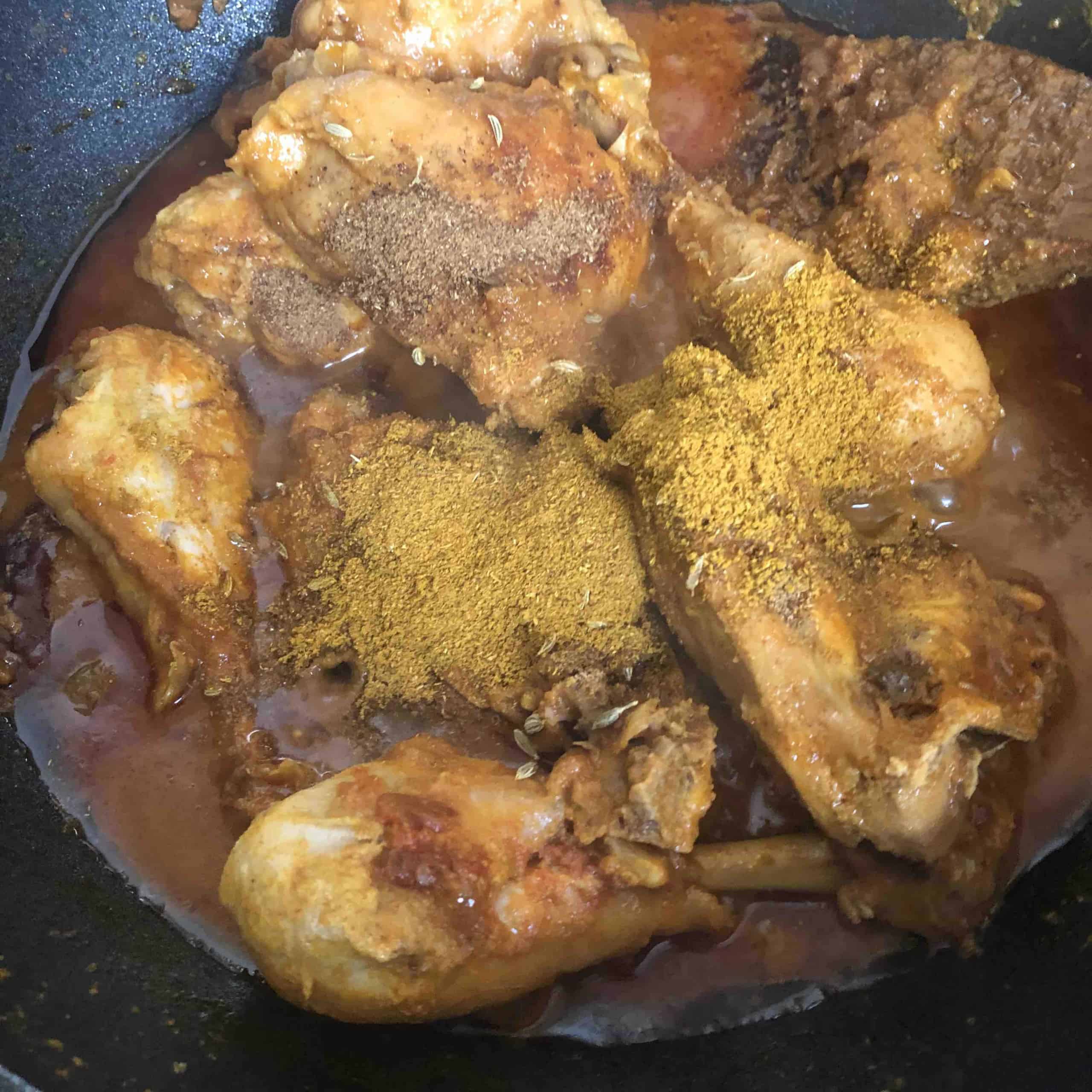 Chicken Bhuna (The Ultimate Restaurant-Style Chicken Curry) Spices added on top of Chickening wok