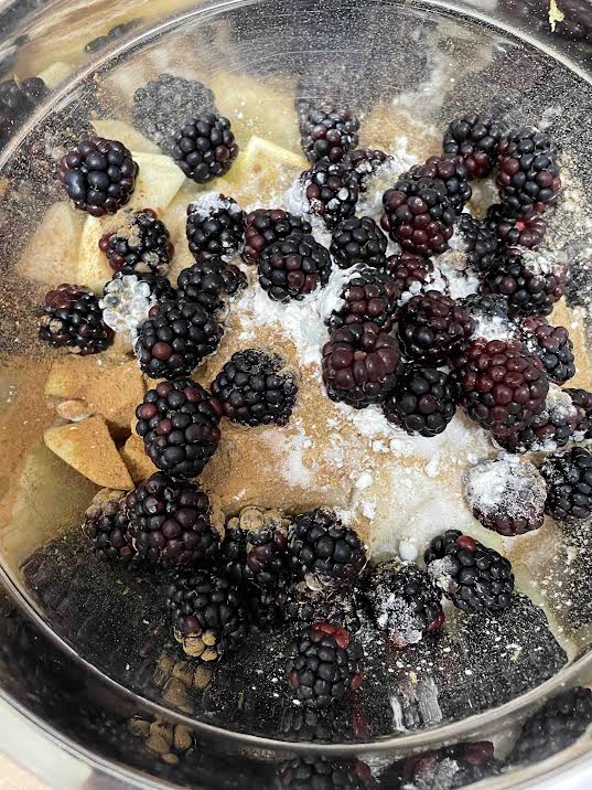 Fruits, sugar and flour in bowl