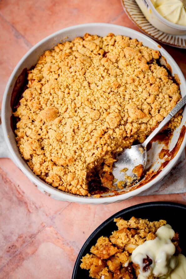 Apple Crumble in dish with Custard and Ice Cream