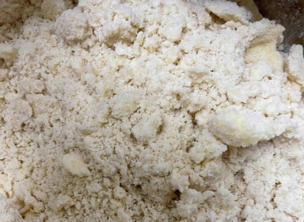 Butter and flour rubbed together to form breadcrumbs in bowl