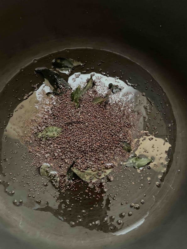 Mustard Seeds and Curry Leaves in pot